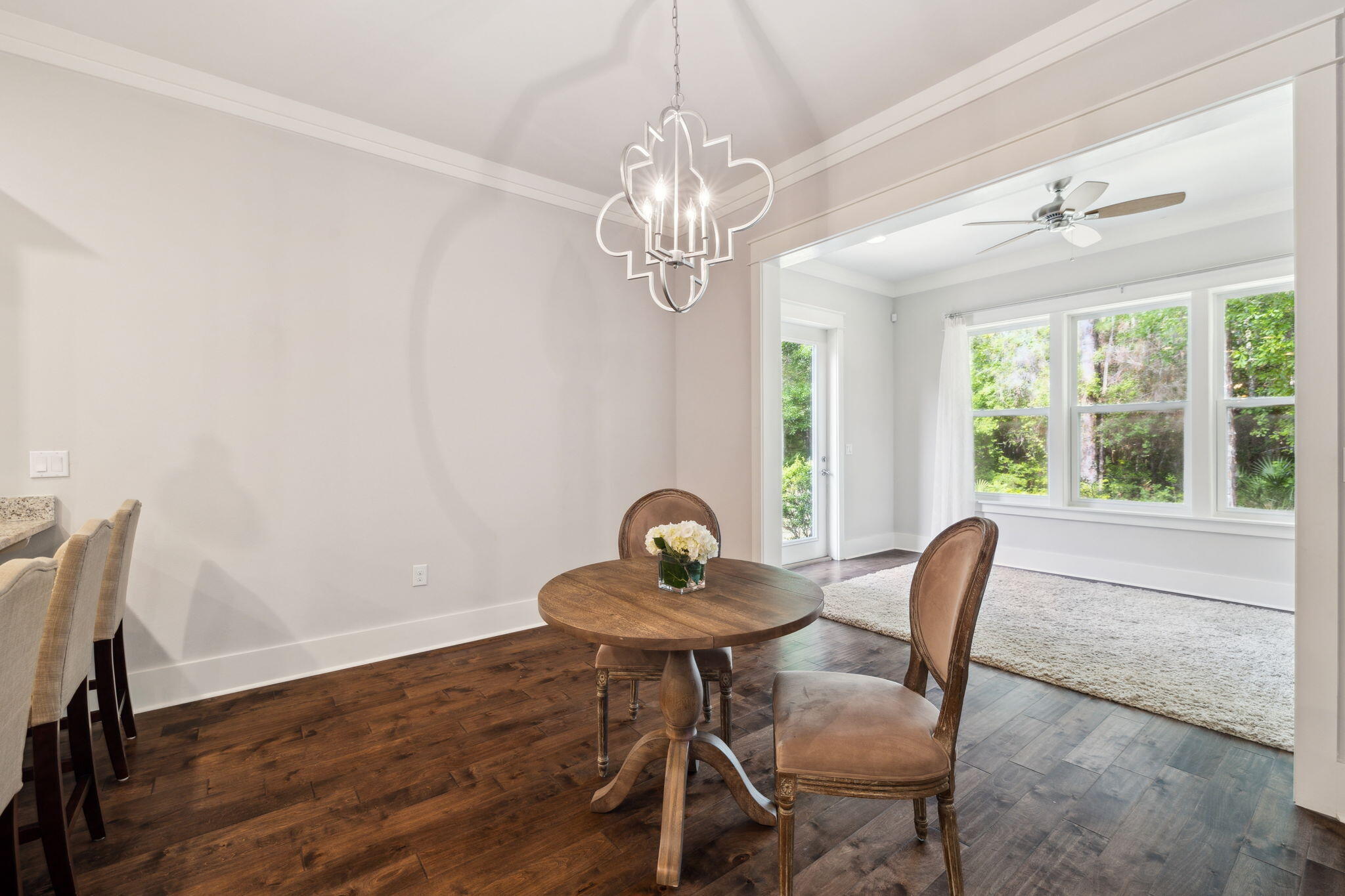 180 Blakely Drew Boulevard Santa Rosa Beach, FL 32459 - Photo 20 of 40 a view of a dining room with furniture window and wooden floor