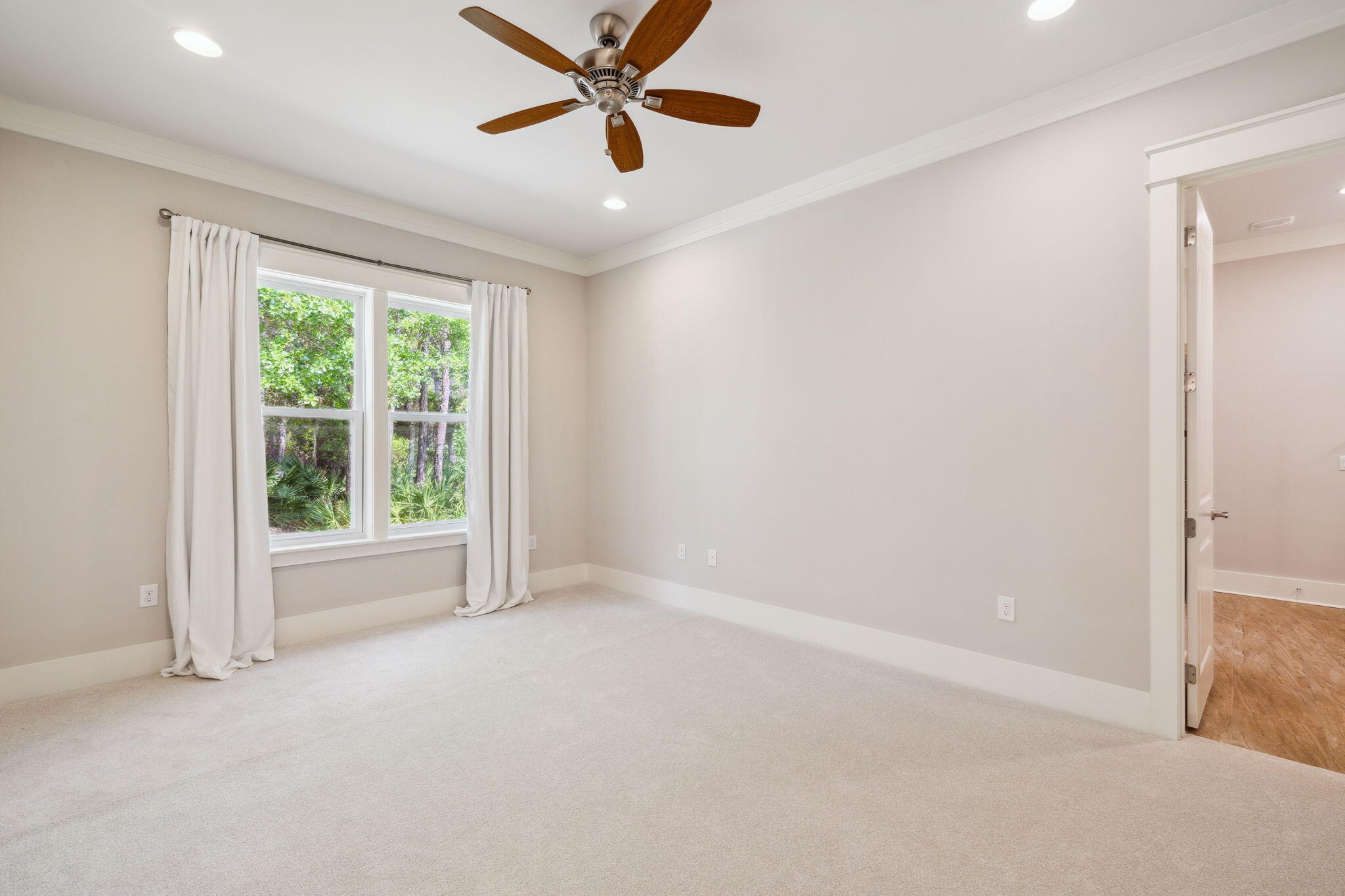 180 Blakely Drew Boulevard Santa Rosa Beach, FL 32459 - Photo 24 of 40 an empty room with a window and a fan