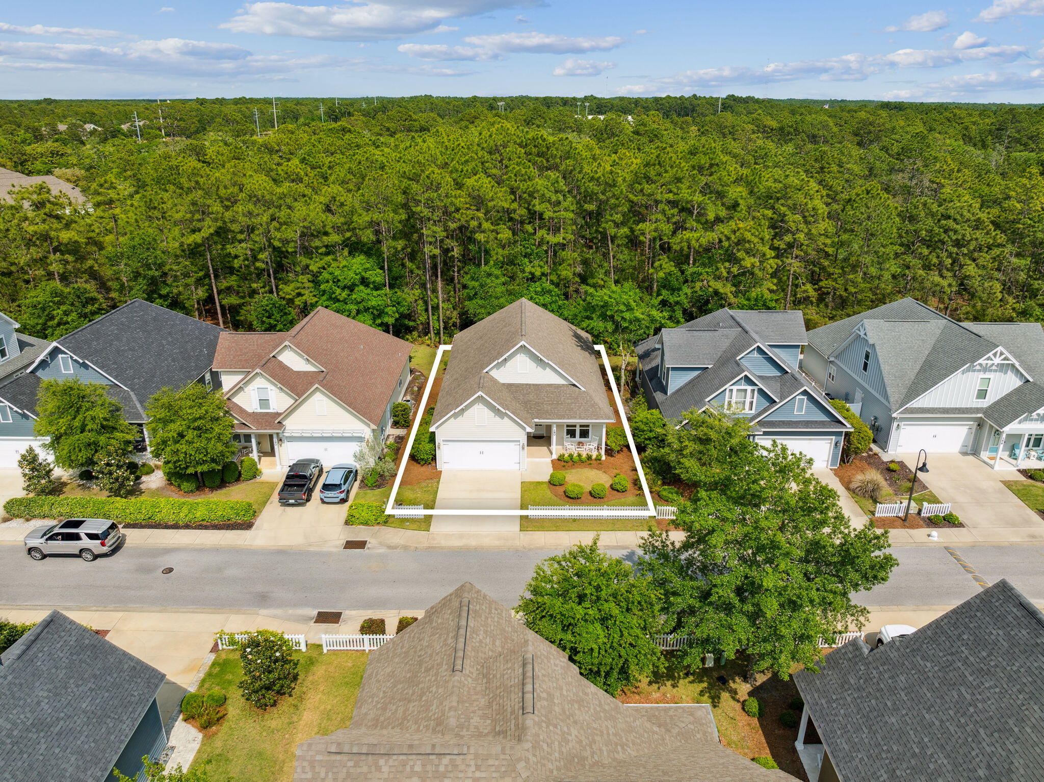 180 Blakely Drew Boulevard Santa Rosa Beach, FL 32459 - Photo 4 of 40 an aerial view of a house with swimming pool and garden