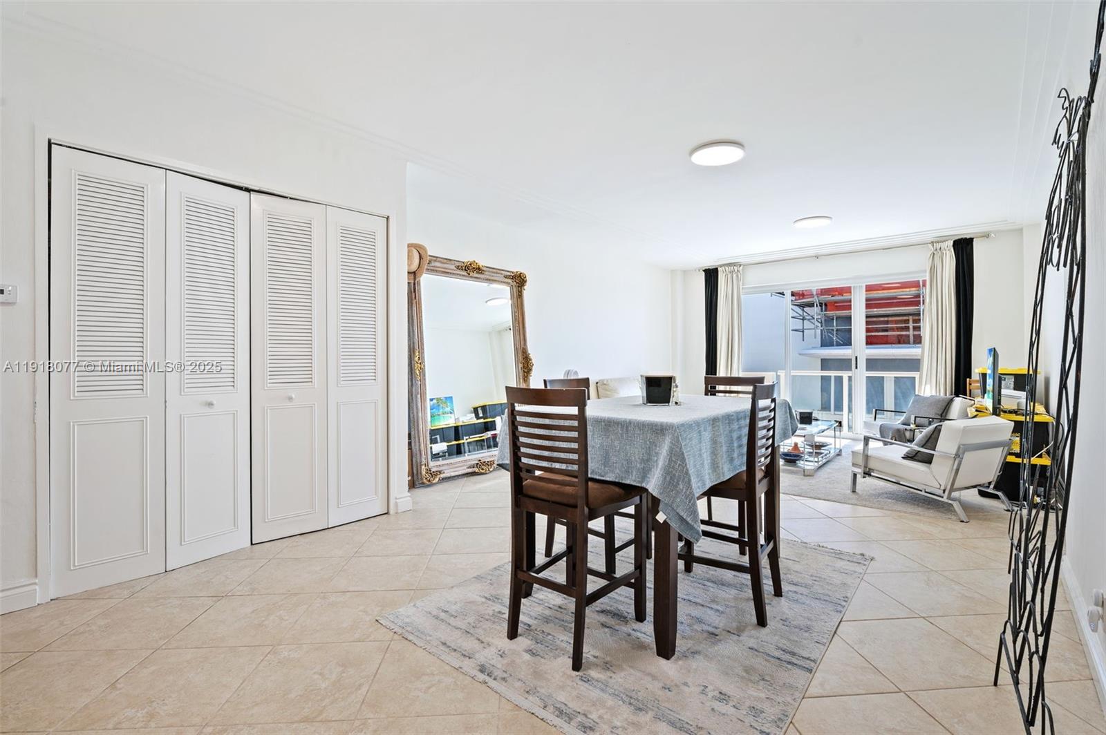 9195 Collins Avenue, Unit PH14 Surfside, FL 33154 - Photo 2 of 26 a view of a livingroom with furniture and window