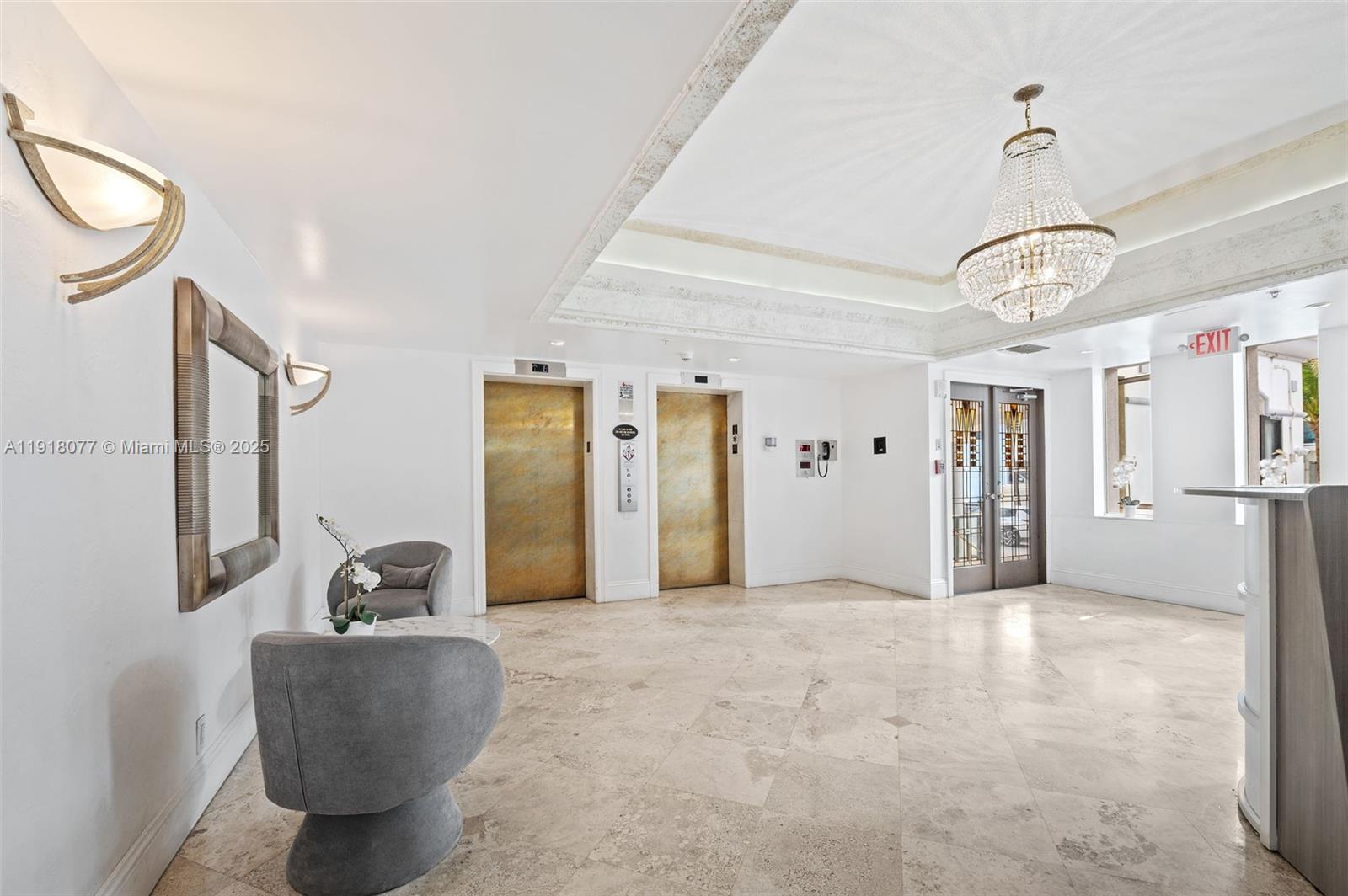 9195 Collins Avenue, Unit PH14 Surfside, FL 33154 - Photo 22 of 26 a view of a livingroom with furniture and windows