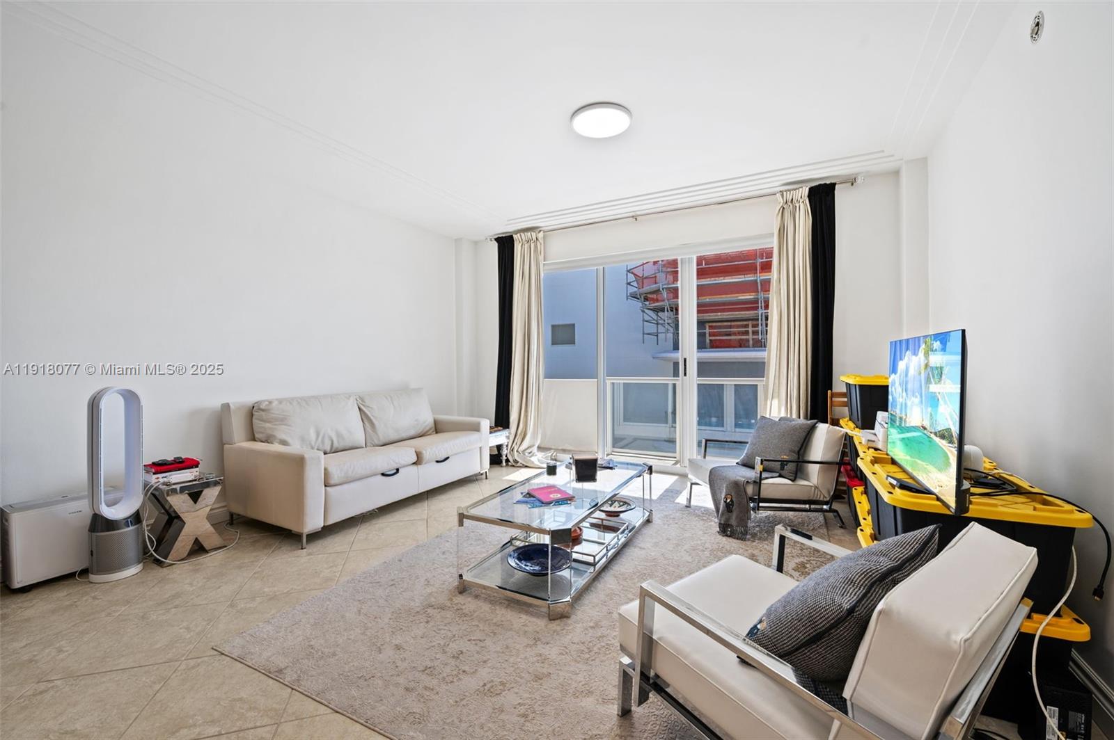 9195 Collins Avenue, Unit PH14 Surfside, FL 33154 - Photo 3 of 26 a living room with furniture and a large window