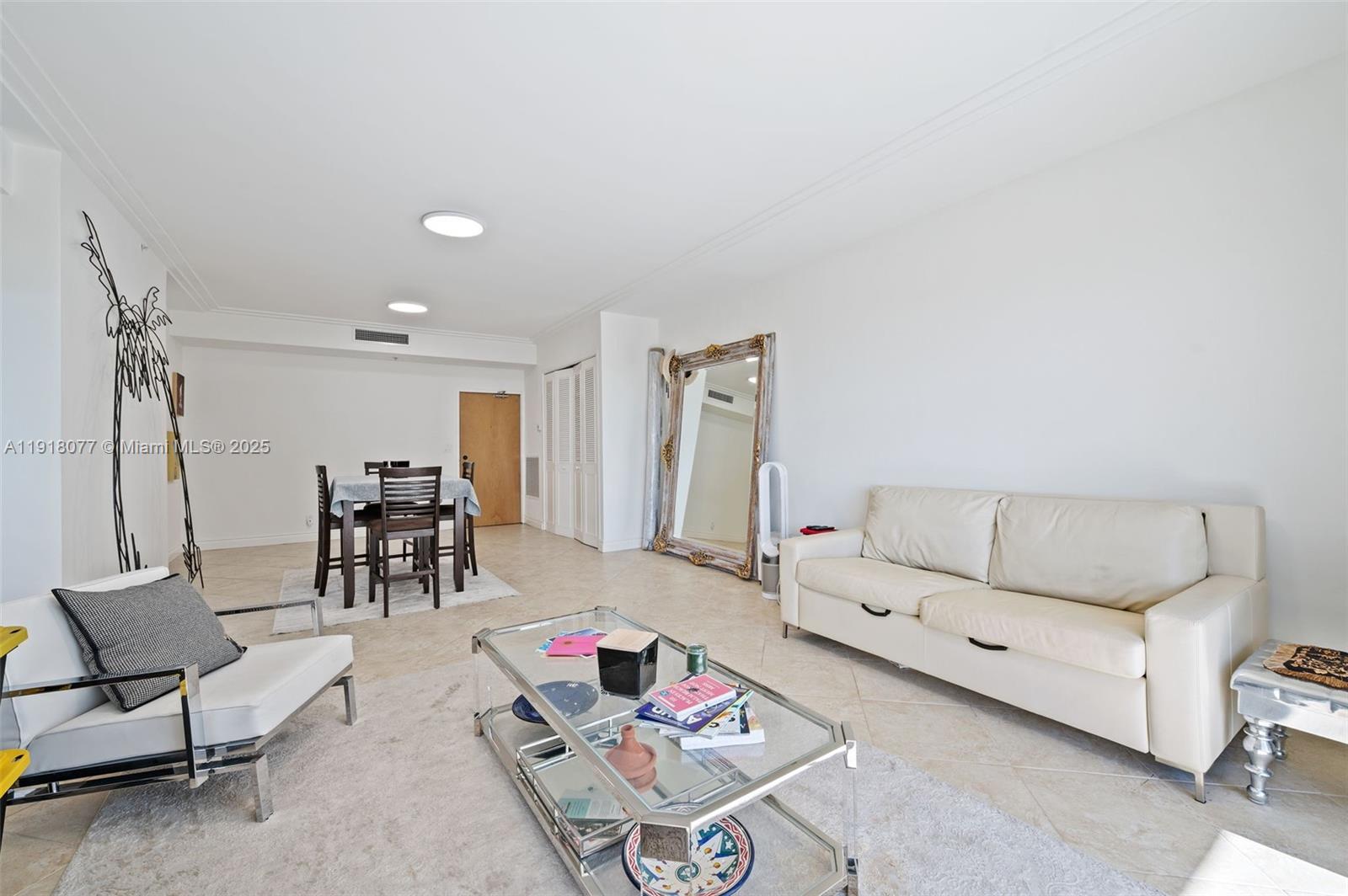 9195 Collins Avenue, Unit PH14 Surfside, FL 33154 - Photo 4 of 26 a living room with furniture and a rug