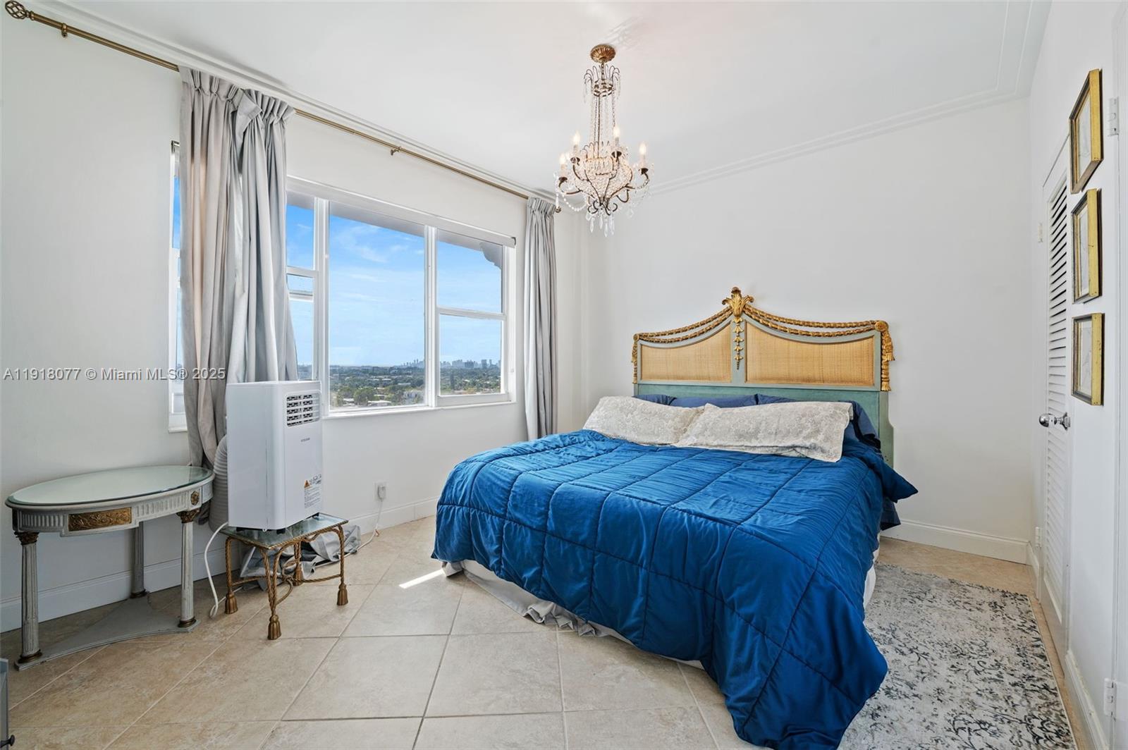 9195 Collins Avenue, Unit PH14 Surfside, FL 33154 - Photo 9 of 26 a bedroom with a bed and a window