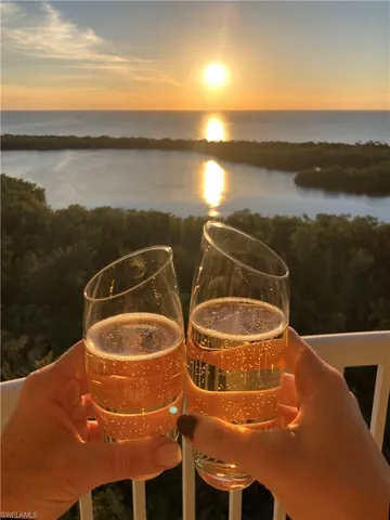 a blue swimming pool with a view of lake and mountain view