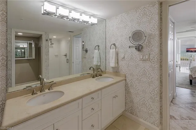 a bathroom with a shower and a sink