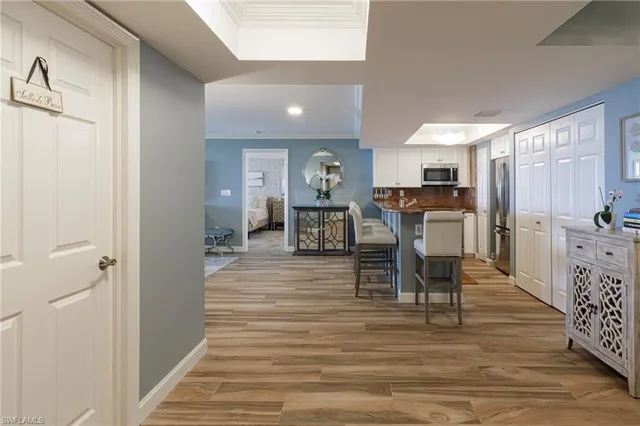 a view of a dining room with furniture and wooden floor