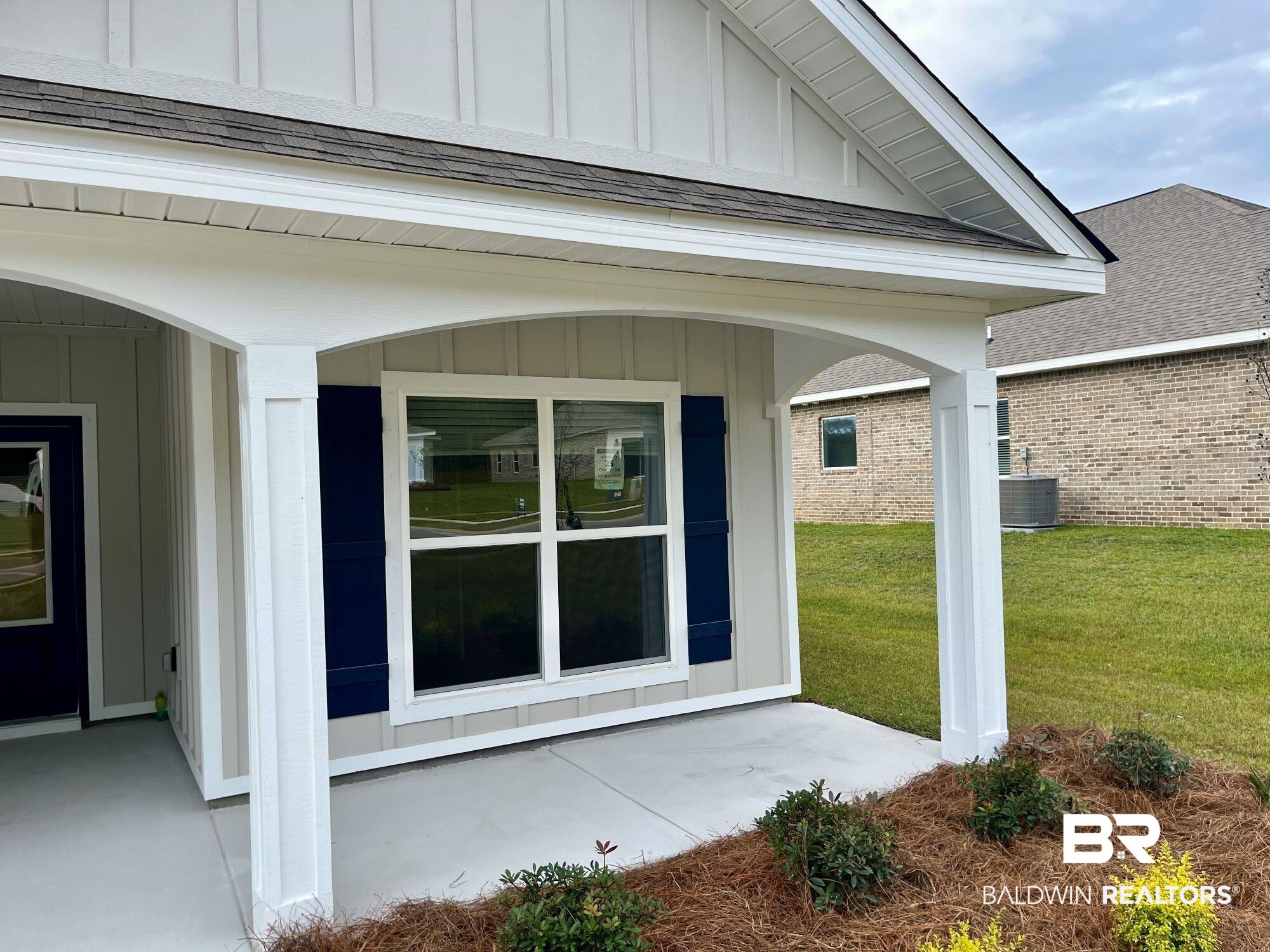 337 Barndling Street Fairhope, AL 36532 - Photo 5 of 34 View of exterior entry featuring a lawn and cooling unit