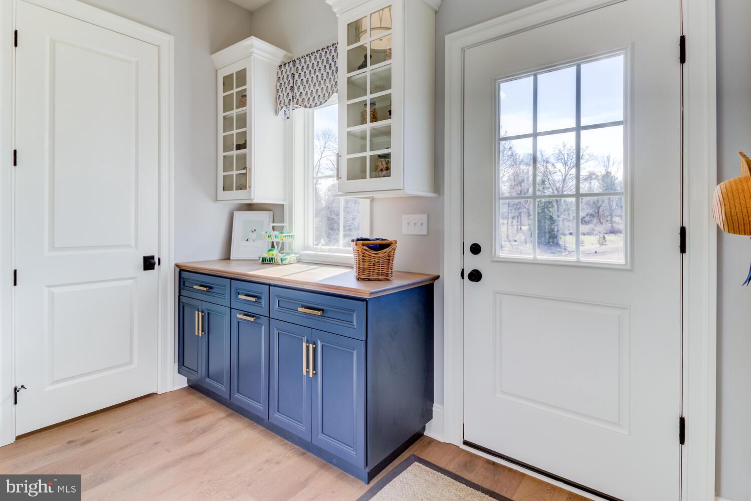 7 Old Covered Bridge Road Newtown Square, PA 19073 - Photo 11 of 45 a kitchen with stainless steel appliances wooden cabinets and a window