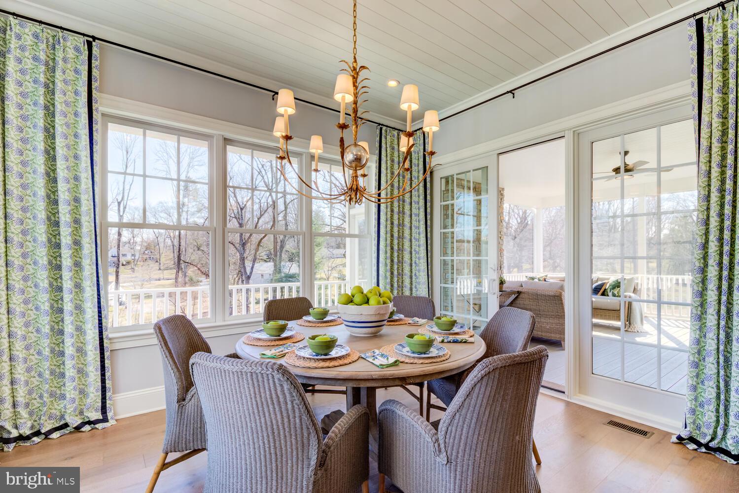 7 Old Covered Bridge Road Newtown Square, PA 19073 - Photo 12 of 45 a view of a dining room with furniture large windows and wooden floor