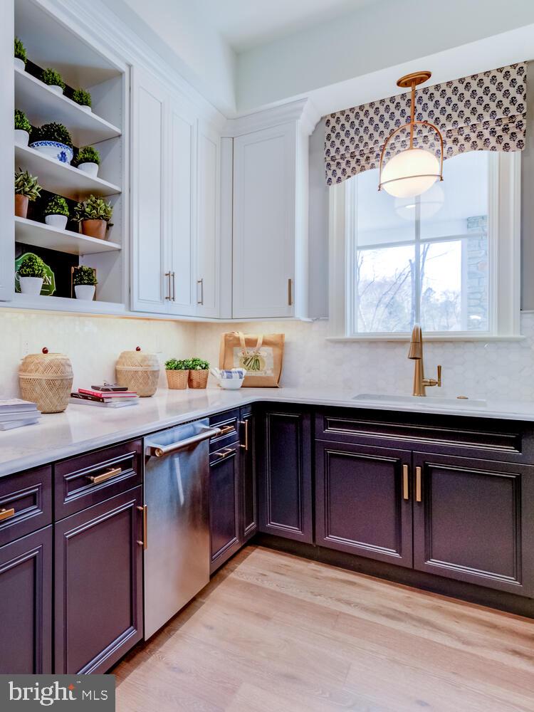 7 Old Covered Bridge Road Newtown Square, PA 19073 - Photo 16 of 45 a kitchen with stainless steel appliances granite countertop a sink dishwasher and cabinets with wooden floor
