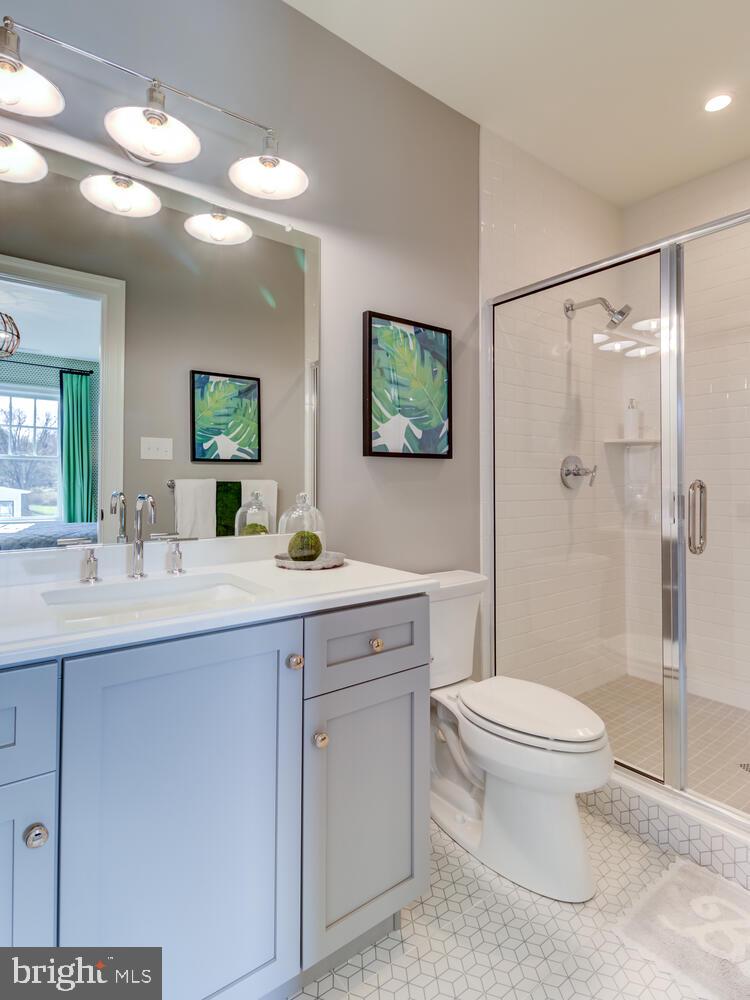 7 Old Covered Bridge Road Newtown Square, PA 19073 - Photo 20 of 45 a bathroom with a granite countertop sink toilet and shower