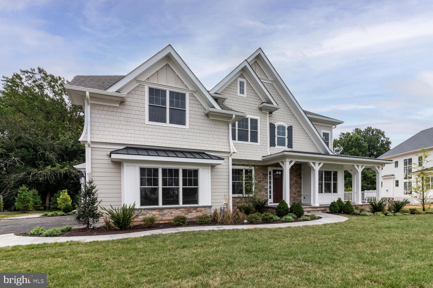 7 Old Covered Bridge Road Newtown Square, PA 19073 - Photo 2 of 45 a front view of a house with a yard and garage