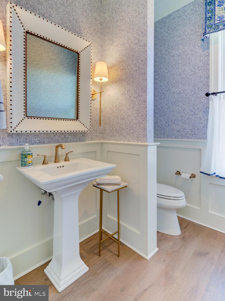 7 Old Covered Bridge Road Newtown Square, PA 19073 - Photo 23 of 45 a bathroom with a toilet sink and a mirror