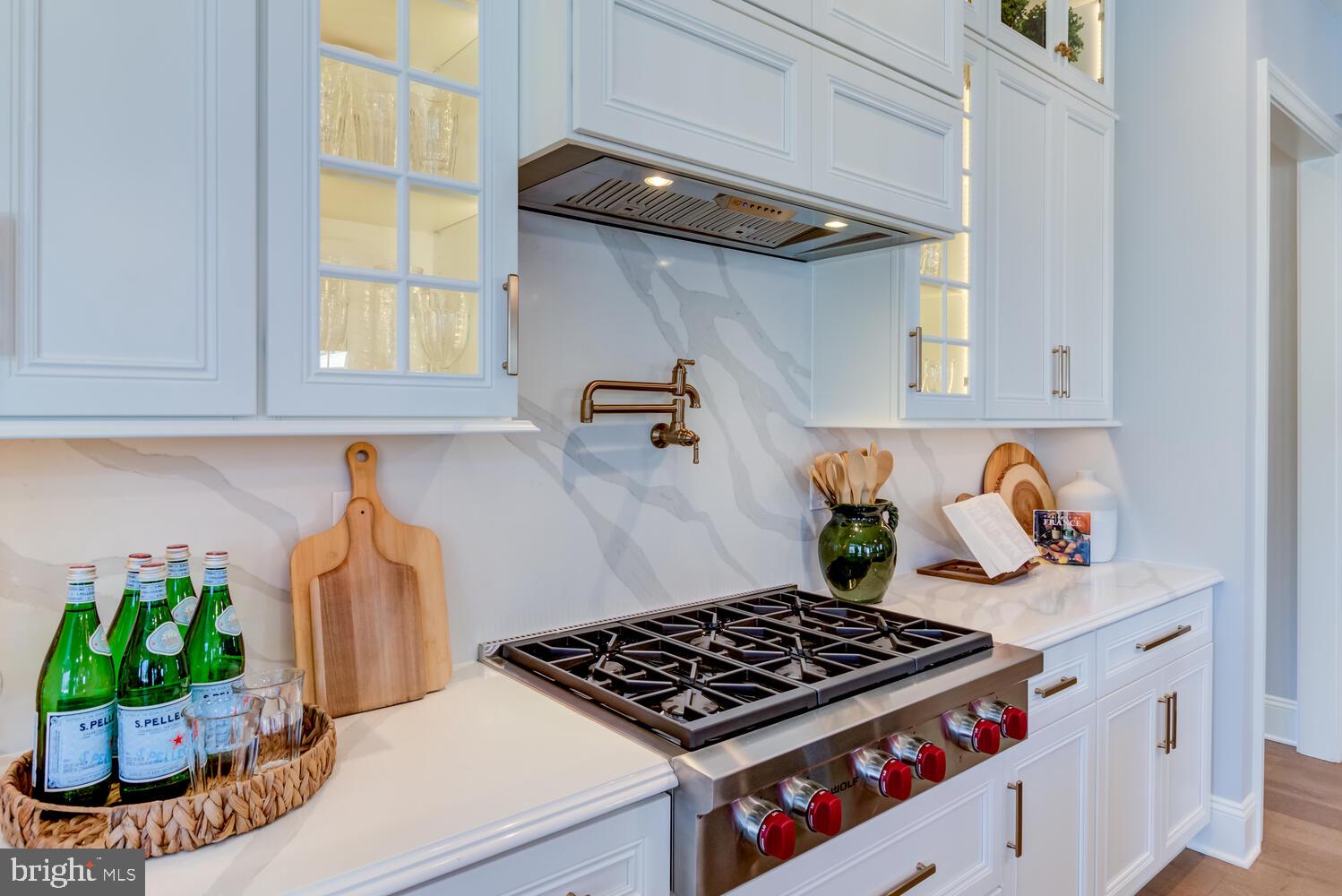 7 Old Covered Bridge Road Newtown Square, PA 19073 - Photo 9 of 45 a kitchen with lots of white cabinets and appliances
