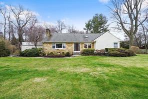 388 Ridge Road Hartsdale, NY 10530 - Photo 1 of 1 a front view of house with yard and green space