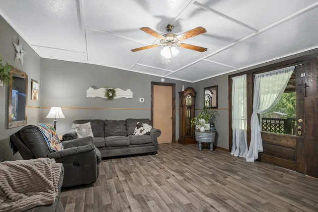 a bedroom with furniture and flat screen tv