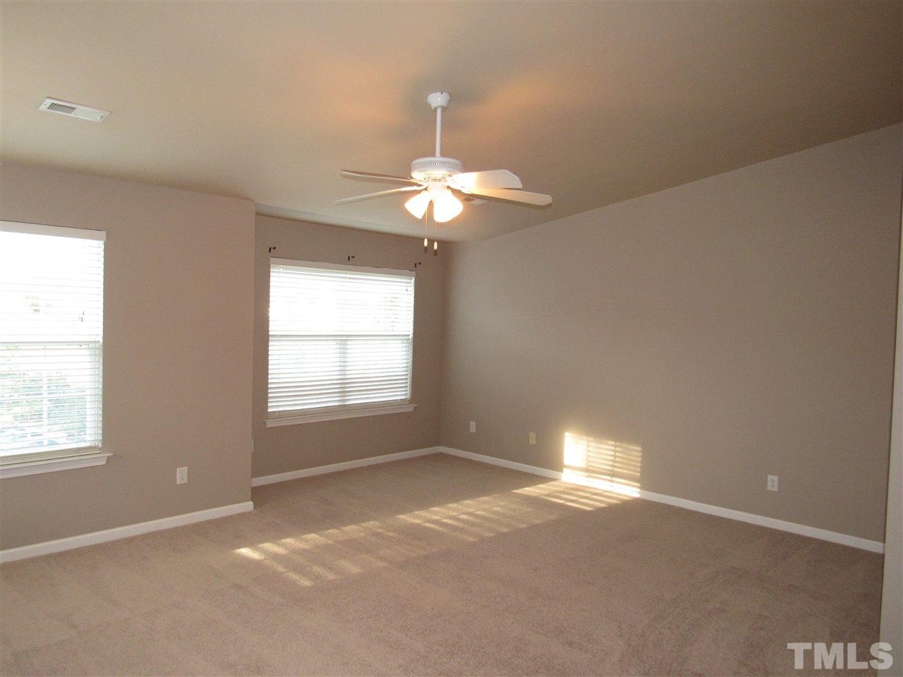 8620 Neuse Landing Lane, Unit 101 Raleigh, NC 27616 - Photo 14 of 16 a view of an empty room with a window