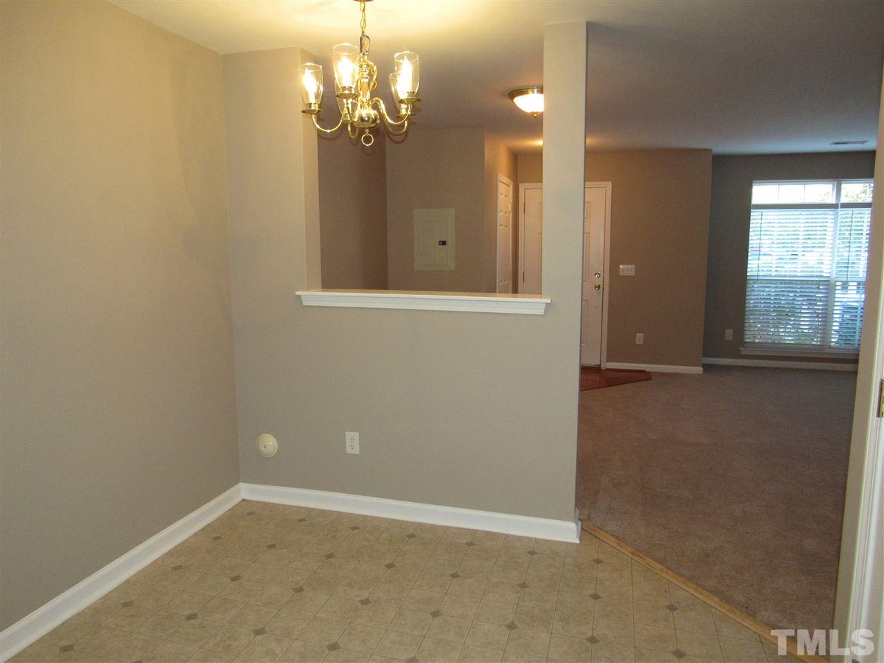 8620 Neuse Landing Lane, Unit 101 Raleigh, NC 27616 - Photo 3 of 16 a view of a chandelier in a room