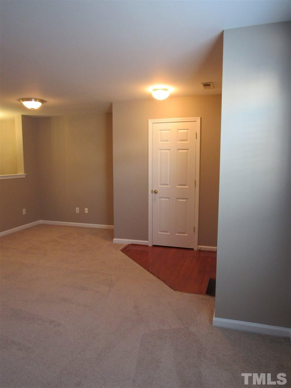 8620 Neuse Landing Lane, Unit 101 Raleigh, NC 27616 - Photo 5 of 16 a view of an empty room