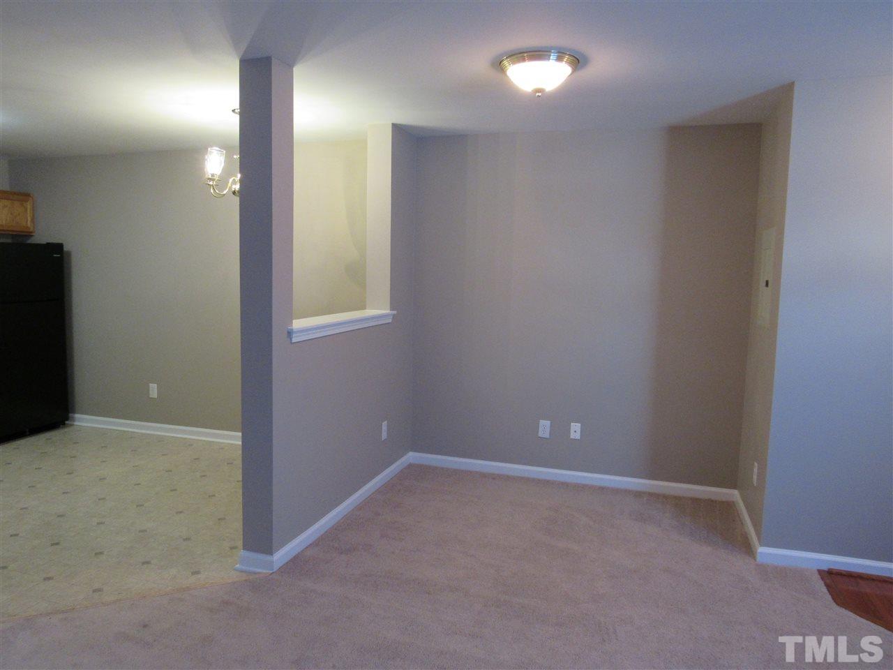 8620 Neuse Landing Lane, Unit 101 Raleigh, NC 27616 - Photo 6 of 16 a view of an empty room