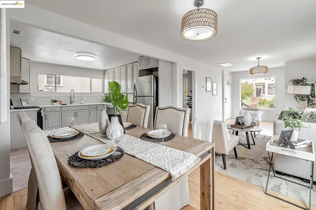 a kitchen with a dining table and chairs