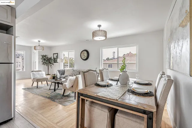 a view of a dining room with furniture and a window