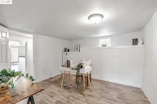 a workspace with furniture and wooden floor