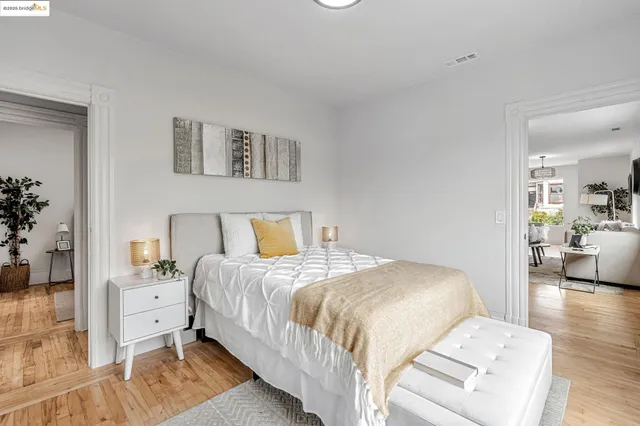 a bedroom with a bed and a couch