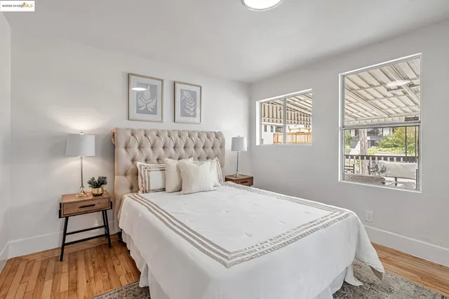 a bedroom with a bed and a night stand