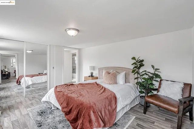 a spacious bedroom with a bed and a couch