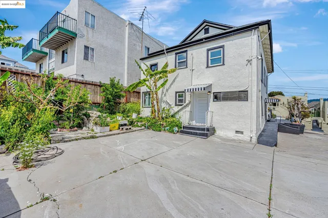 a view of a house with a street