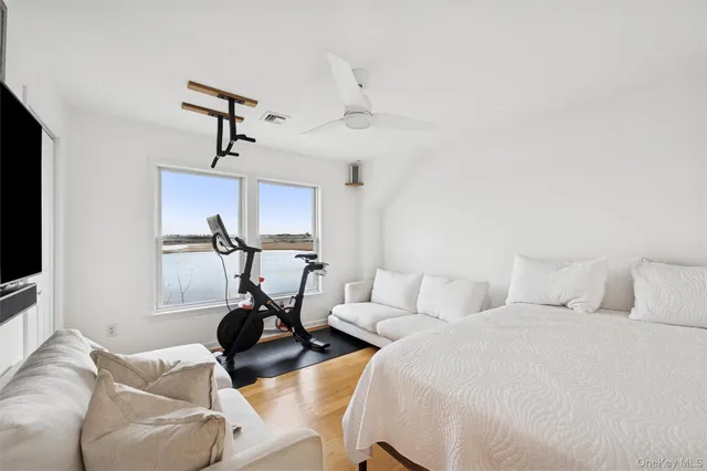a bed room with two beds and a flat screen tv
