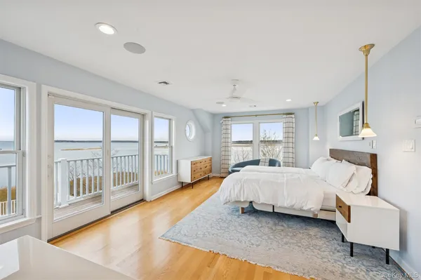 a bed room with a bed and a large window