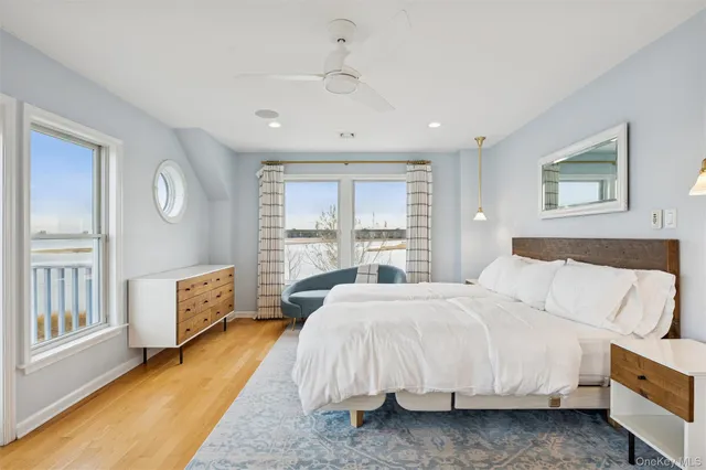 a spacious bedroom with a large bed and a window