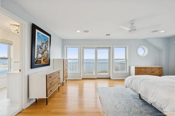a spacious bedroom with a large bed and a couch