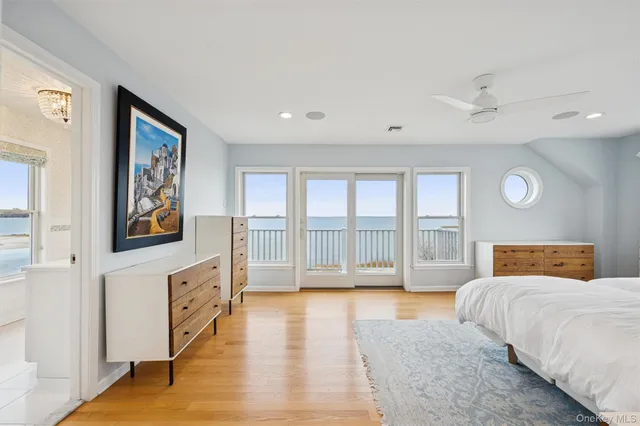 a spacious bedroom with a large bed and a couch