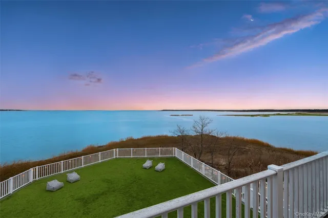 a view of a balcony with an ocean