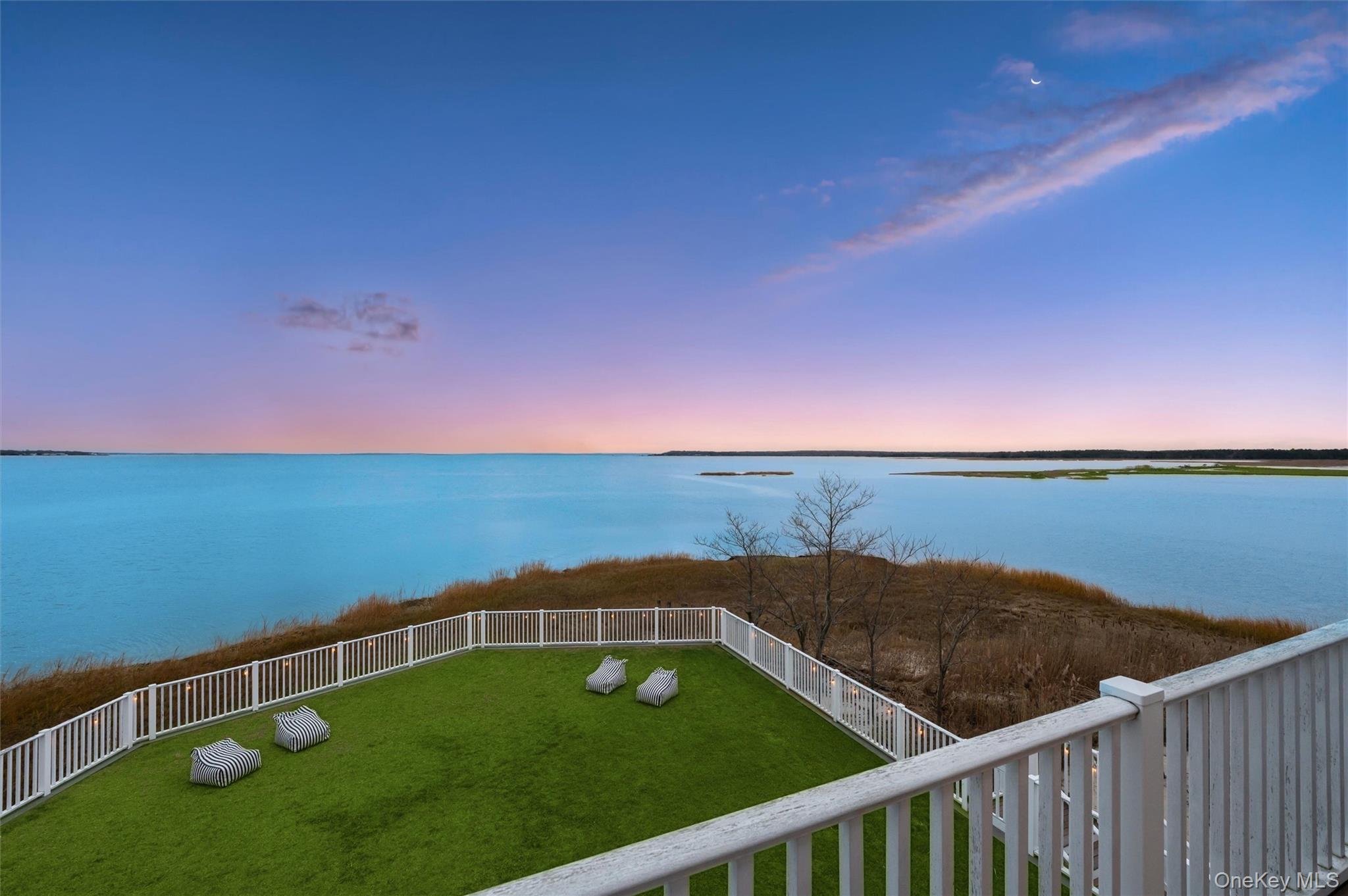 112 Pine Avenue Flanders, NY 11901 - Photo 3 of 29 a view of a balcony with an ocean