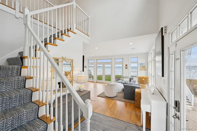 a view of entryway and hall with wooden floor
