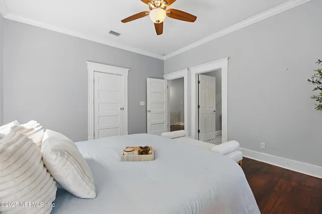 a bed room with a bed and a chandelier