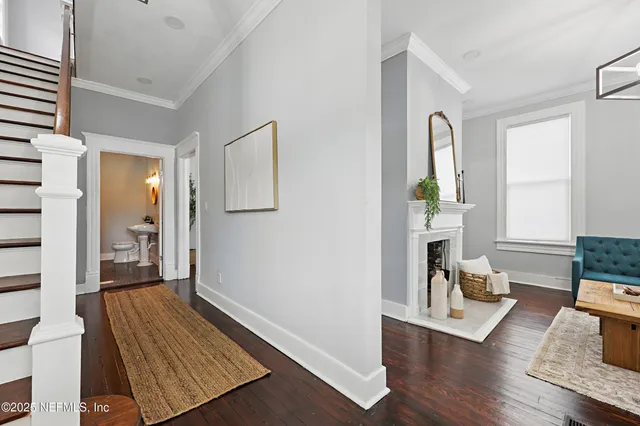 a living room with furniture and a fireplace