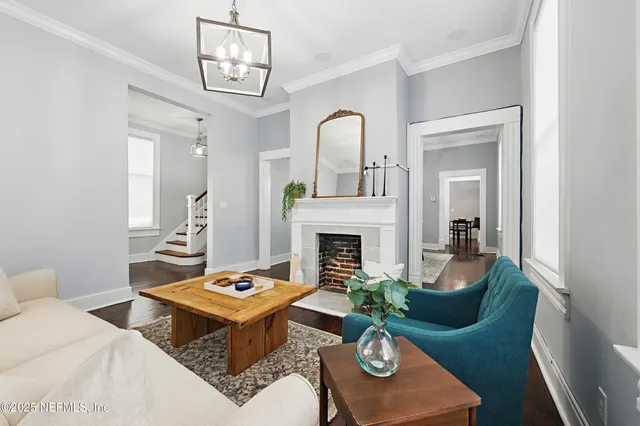 a living room with furniture and a fireplace