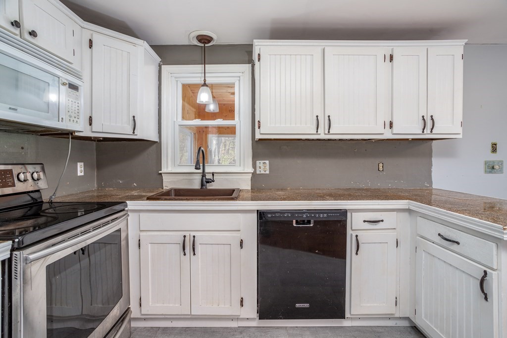 1 Needham Road Westminster, MA 01473 - Photo 11 of 42 a kitchen with granite countertop white cabinets and a sink