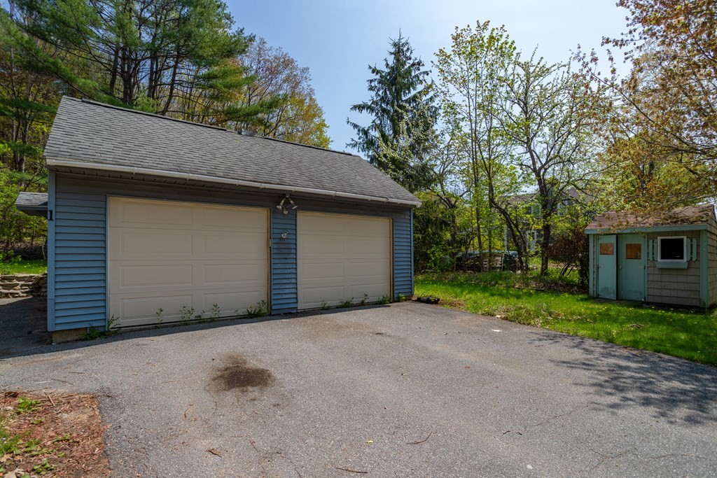 1 Needham Road Westminster, MA 01473 - Photo 36 of 42 a front view of a house with a yard and garage