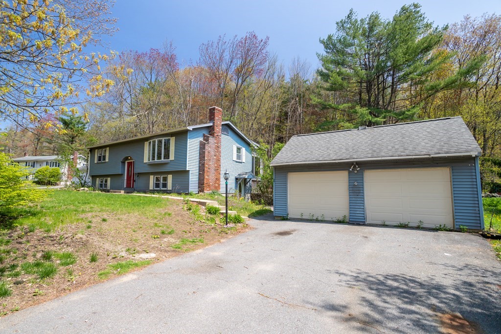 1 Needham Road Westminster, MA 01473 - Photo 37 of 42 a front view of a house with a yard and garage