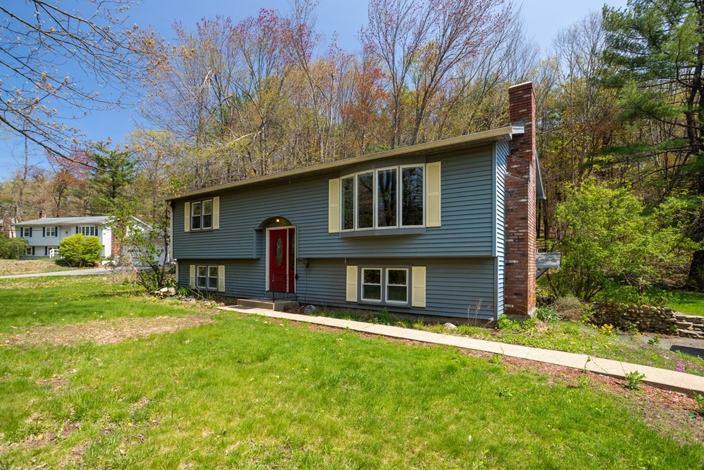 1 Needham Road Westminster, MA 01473 - Photo 40 of 42 a front view of a house with a yard table and chairs
