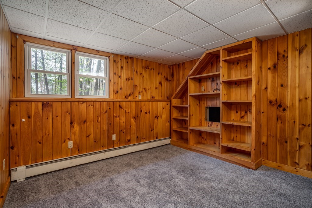 1 Needham Road Westminster, MA 01473 - Photo 8 of 42 a view of an empty room with a fireplace and a window