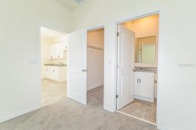 aerial view of a swimming pool with outdoor seating and yard