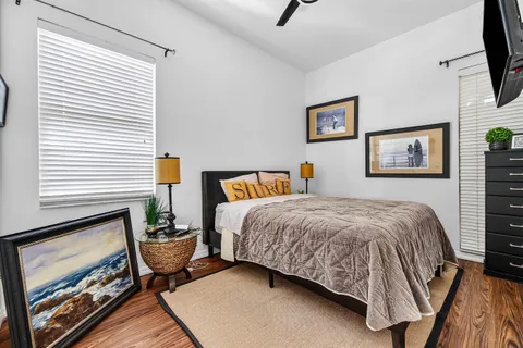 a bedroom with a bed and flat screen tv